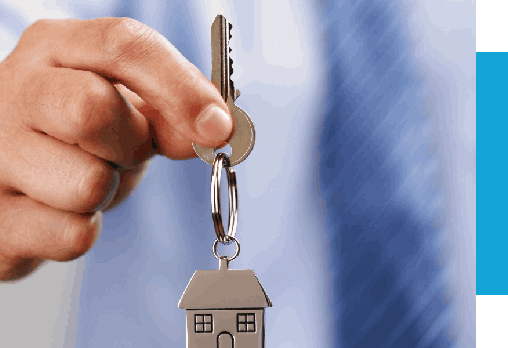 Holding out house key of a house shaped keychain